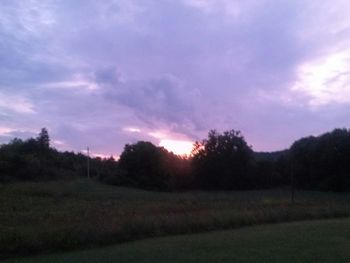 Scenic view of landscape against sky at sunset