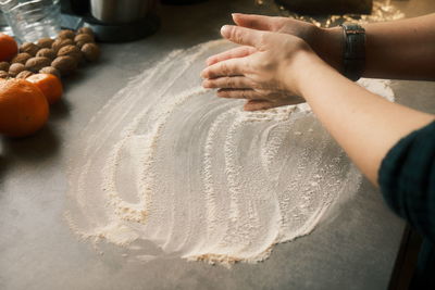 Midsection of person preparing food