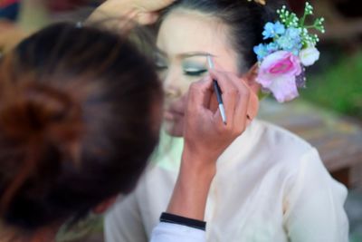 Artist applying make-up with brush