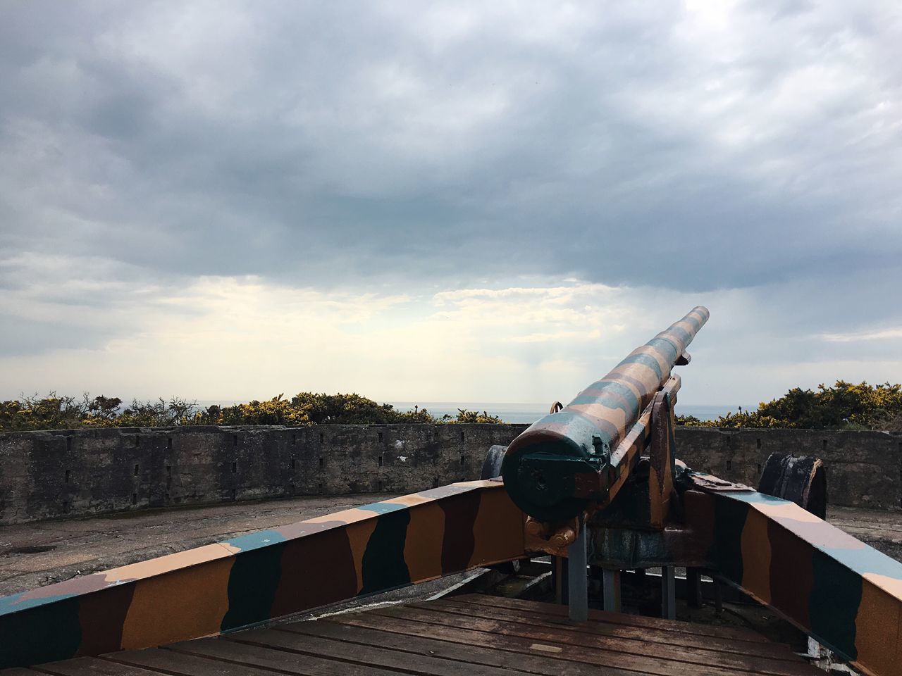 cloud - sky, sky, architecture, nature, day, no people, history, the past, built structure, outdoors, railing, metal, military, cannon, tree, travel destinations, overcast, old, plant