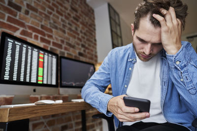 Young man using mobile phone