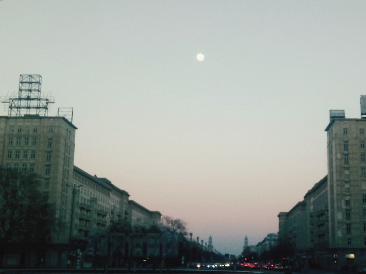 BUILDINGS AGAINST CLEAR SKY AT DUSK