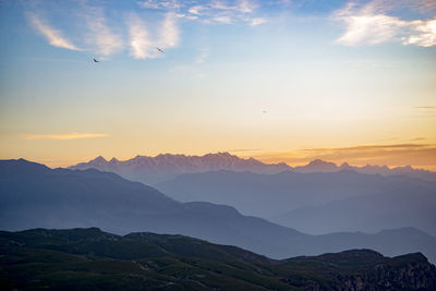 Scenic view of mountains against sky during sunset