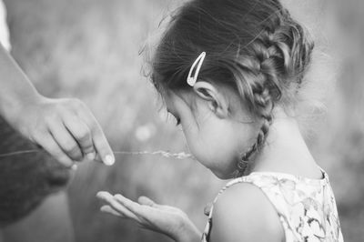 Close-up of young woman with hands