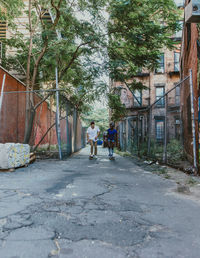 People walking on street amidst buildings