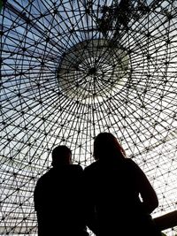 Low angle view of silhouette man against sky