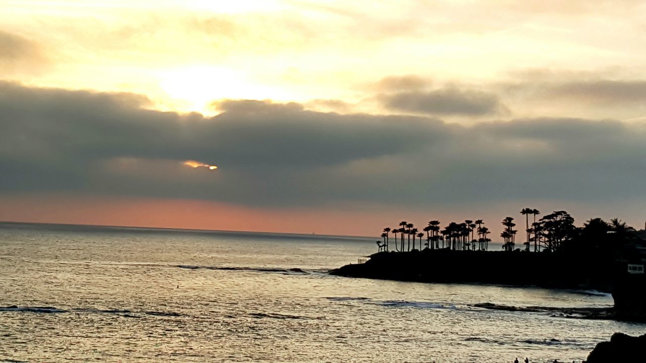 sea, horizon over water, water, sunset, sky, scenics, tranquil scene, tranquility, beauty in nature, beach, cloud - sky, nature, idyllic, shore, cloudy, cloud, silhouette, built structure, orange color, pier