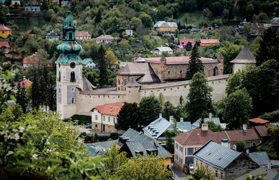 High angle view of houses and trees in town