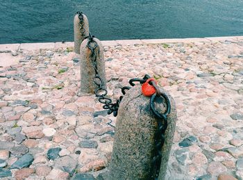 Chain on bollards by sea