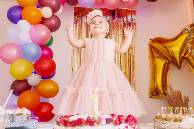 Rear view of woman with balloons