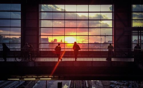 People in city at sunset