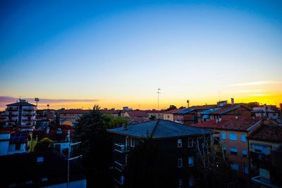 Cityscape against sky during sunset