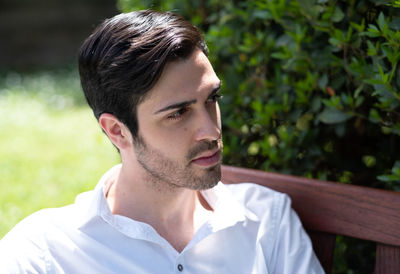 Portrait of young man looking away