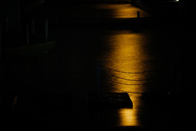 Reflection of illuminated building in water at night