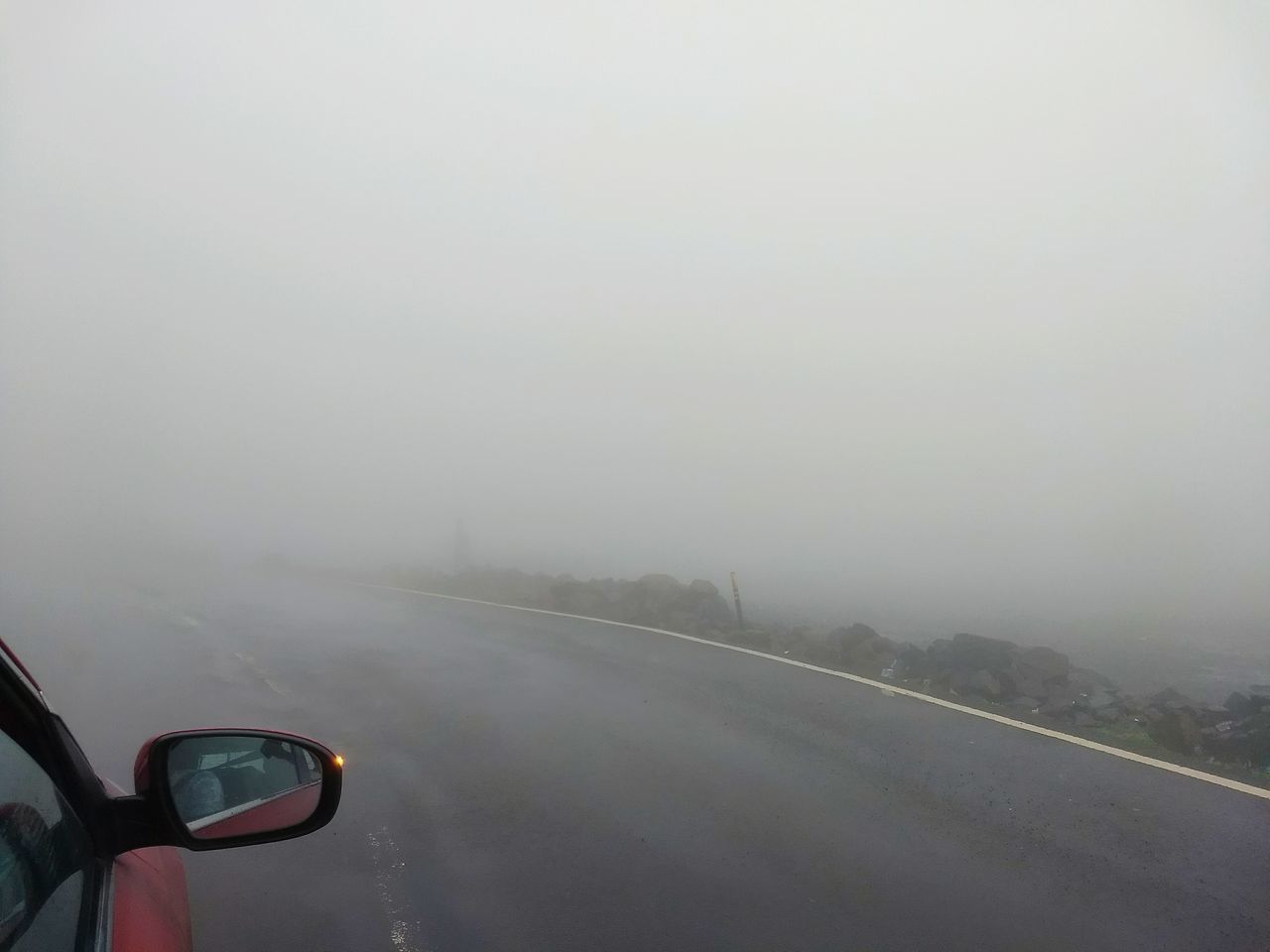 ROAD SEEN THROUGH CAR WINDSHIELD