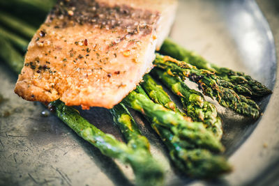 Close-up of fish on barbecue grill