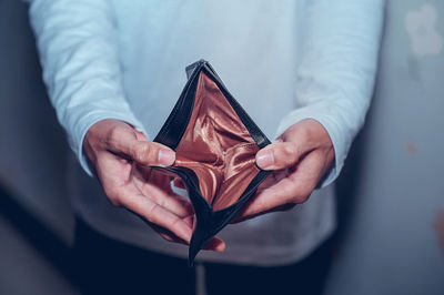 Close-up of man holding paper