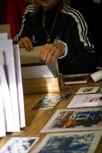 Midsection of man working on table