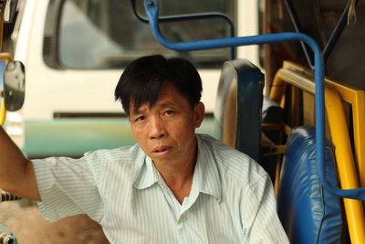 Portrait of woman sitting in train