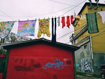 Clothes drying against buildings in city