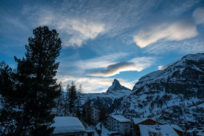 Snow covered mountains against sky