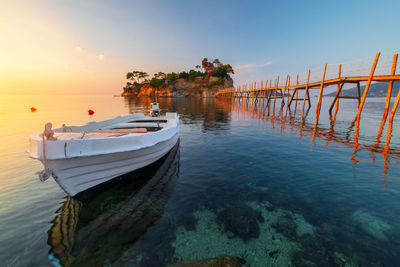 Boats moored at harbor