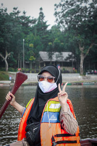 Full length of senior woman standing on boat