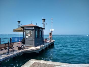 View of a lake from an awkward against clear blue sky