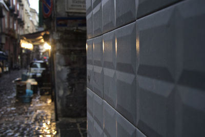 Close-up of wet illuminated railroad station