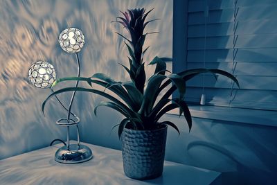 Close-up of lamp on table at home