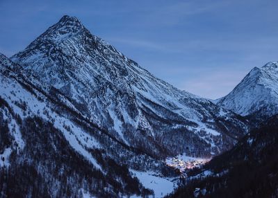 Scenic view of snowcapped mountains against sky