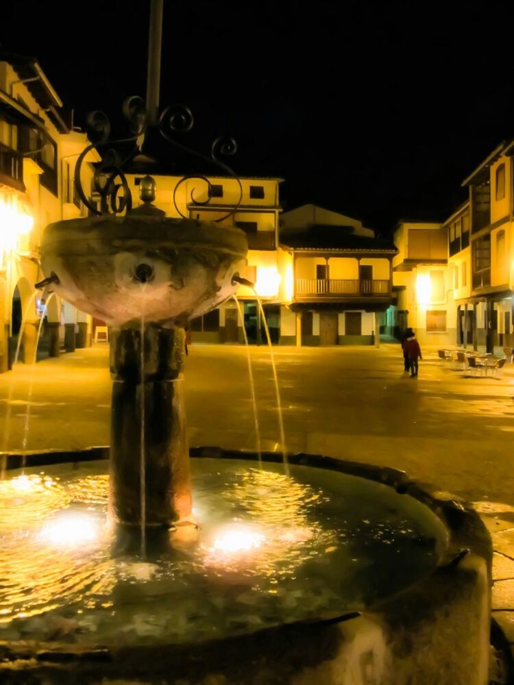 VIEW OF ILLUMINATED STREET AT NIGHT