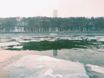 Scenic view of frozen lake against clear sky