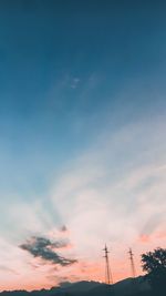 Low angle view of silhouette tower against sky during sunset