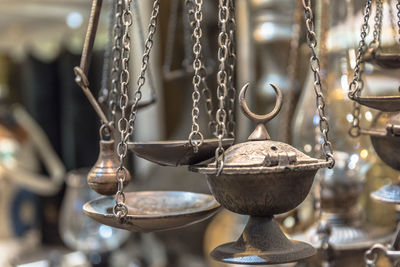 Close-up of old metal hanging outside building