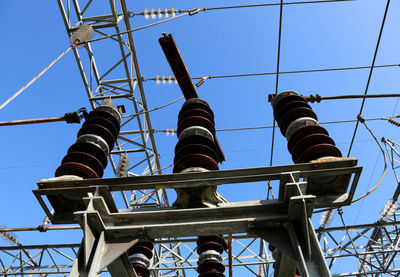 Low angle view of tower against blue sky