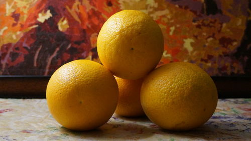 Close-up of oranges on table