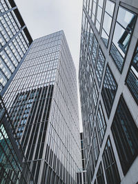 Low angle view of modern buildings against sky