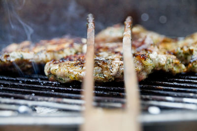 Close-up of pork cooking on barbecue grill