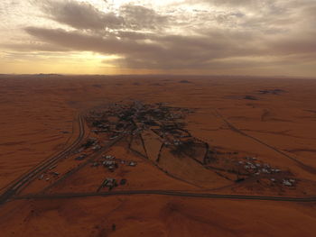 High angle view of desert against sky during sunset