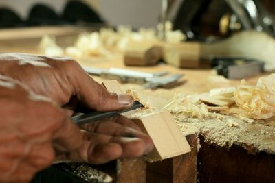 Close-up of hand holding wood