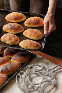 Cropped hand of person preparing food