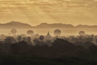 Silhouette of hot air balloon against sky