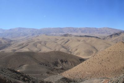 Scenic view of arid landscape against sky