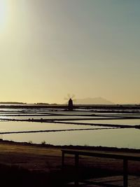 Scenic view of field against sky during sunset