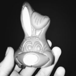 Close-up of light bulb over black background