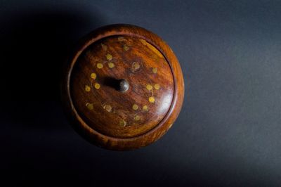 Close-up of rusty over black background