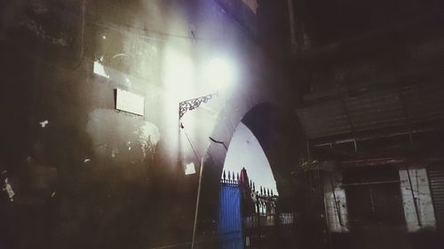 Low angle view of illuminated building at night