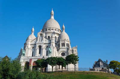 Low angle view of cathedral against clear blue sky