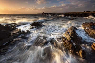 Scenic view of sea against sky during sunset